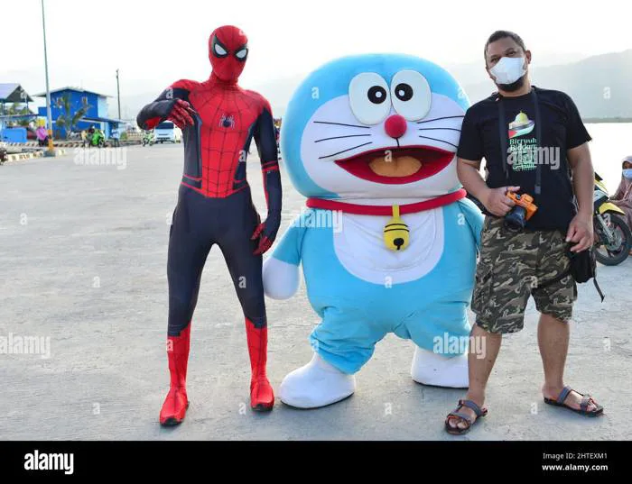 Man with a mask posing with Spiderman and Doraemon. Cosplay in Palopo, Indonesia Stock Photo - Alamy