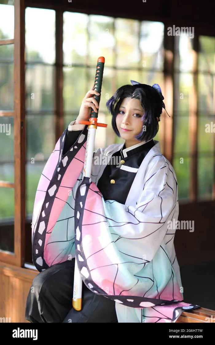 Japan anime cosplay portrait of girl with comic costume with japanese theme garden Stock Photo - Alamy